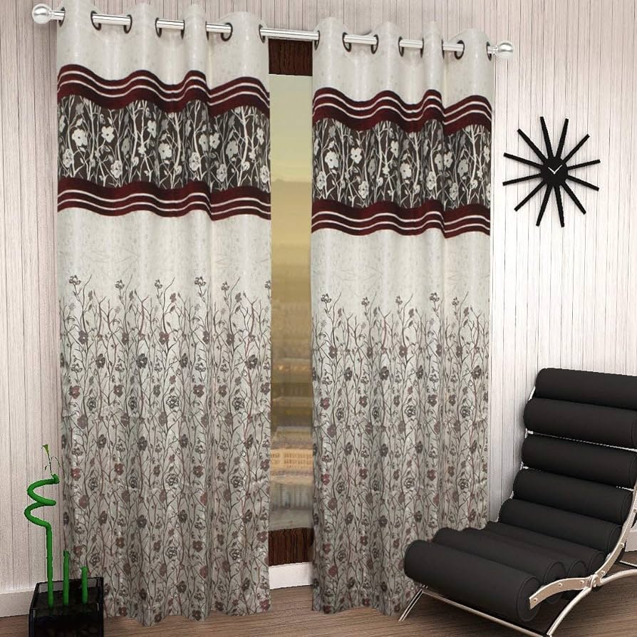 A window curtain with a beautiful floral design, adding elegance and charm to any room decor.