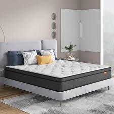 A mattress with a mattress topper, providing added comfort and support.